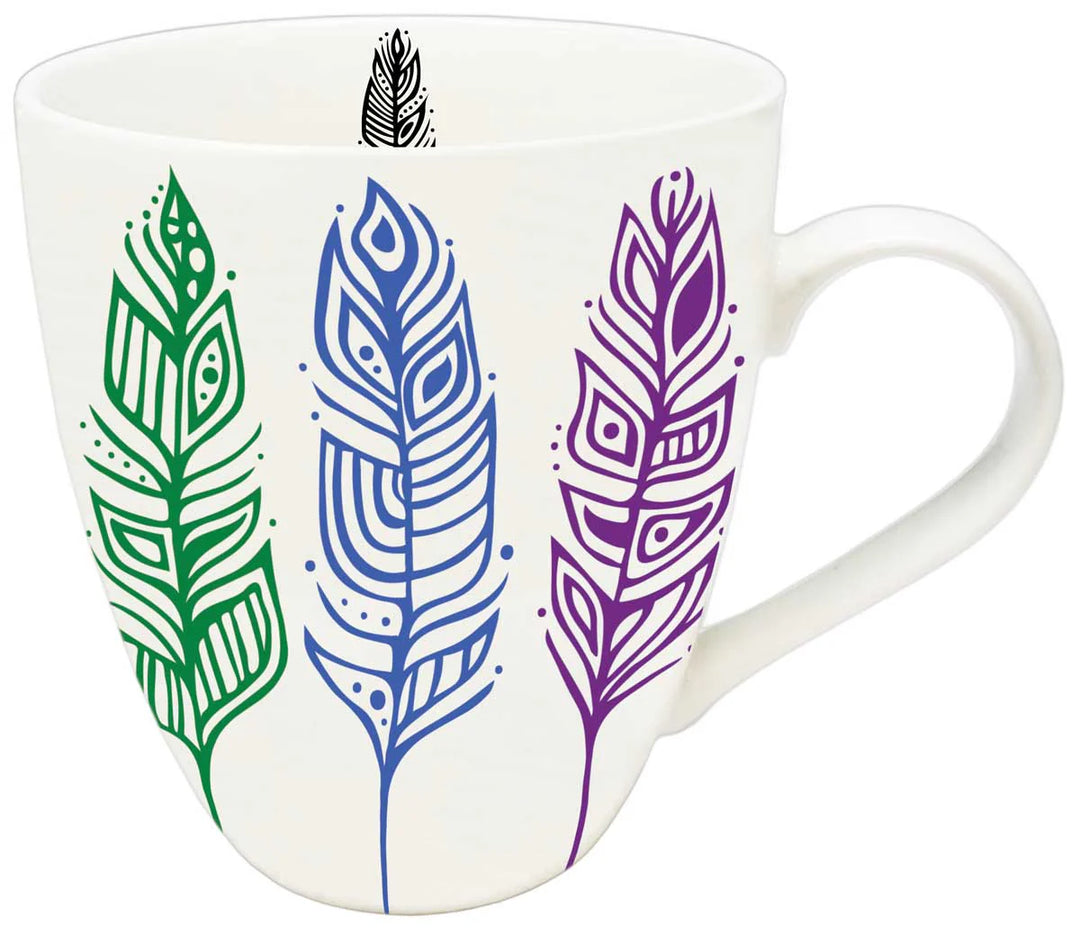 White mug with colorful feather designs on a white background